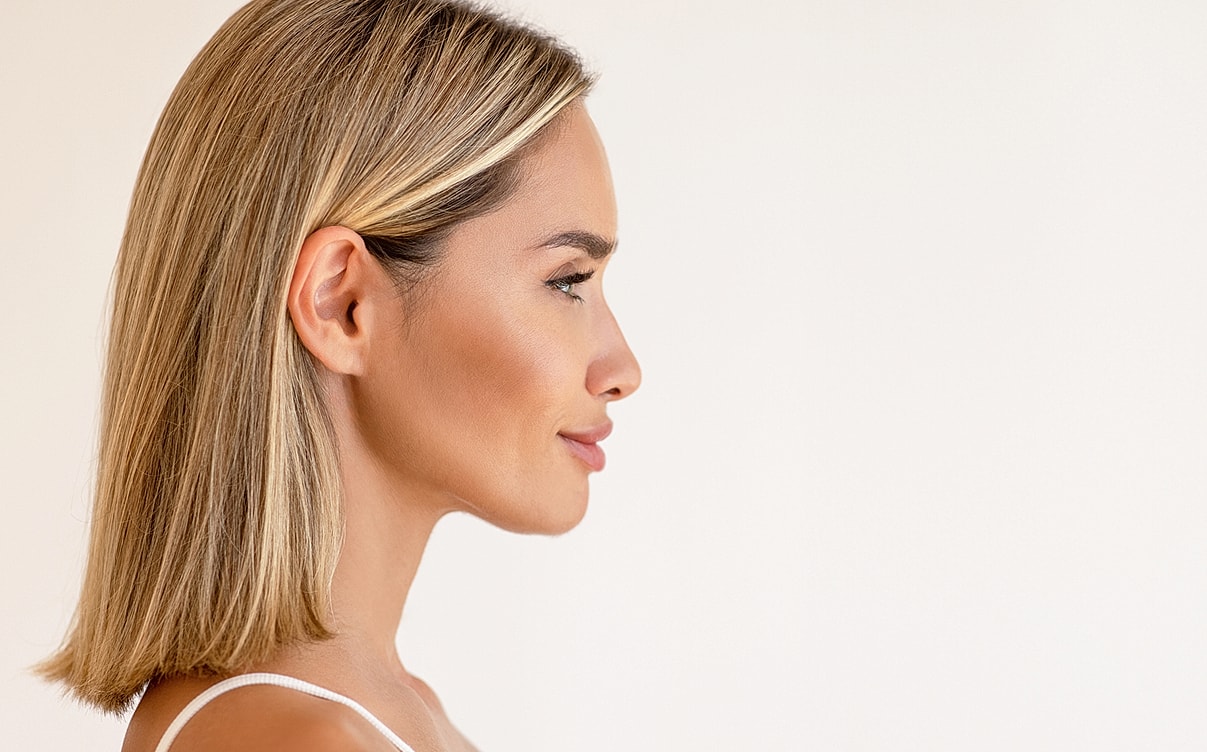 Profile view of a woman with blonde hair.
