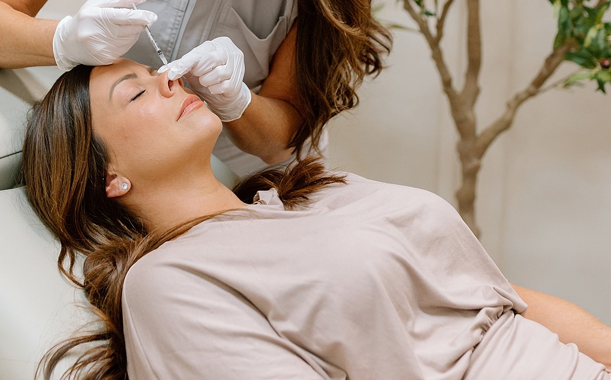Facial treatment procedure in a clinical setting.